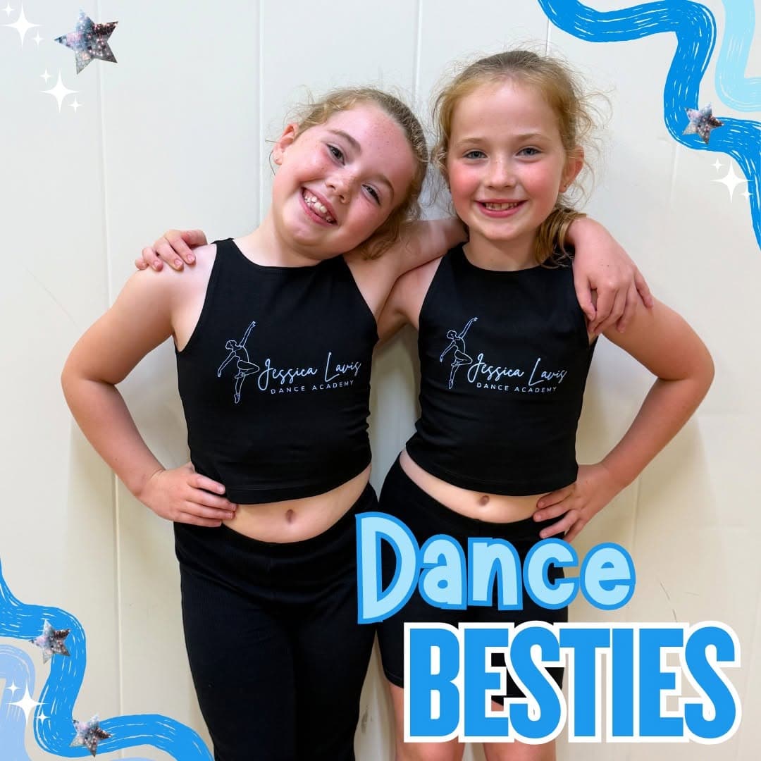 Two best friends in black JLDA vests with their arms around each other