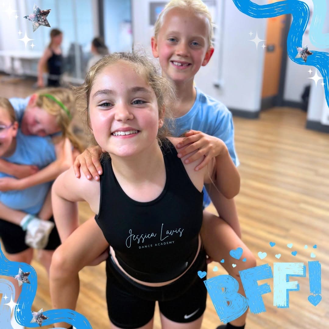 A dancer giving her friend a piggyback in the studio, both laughing