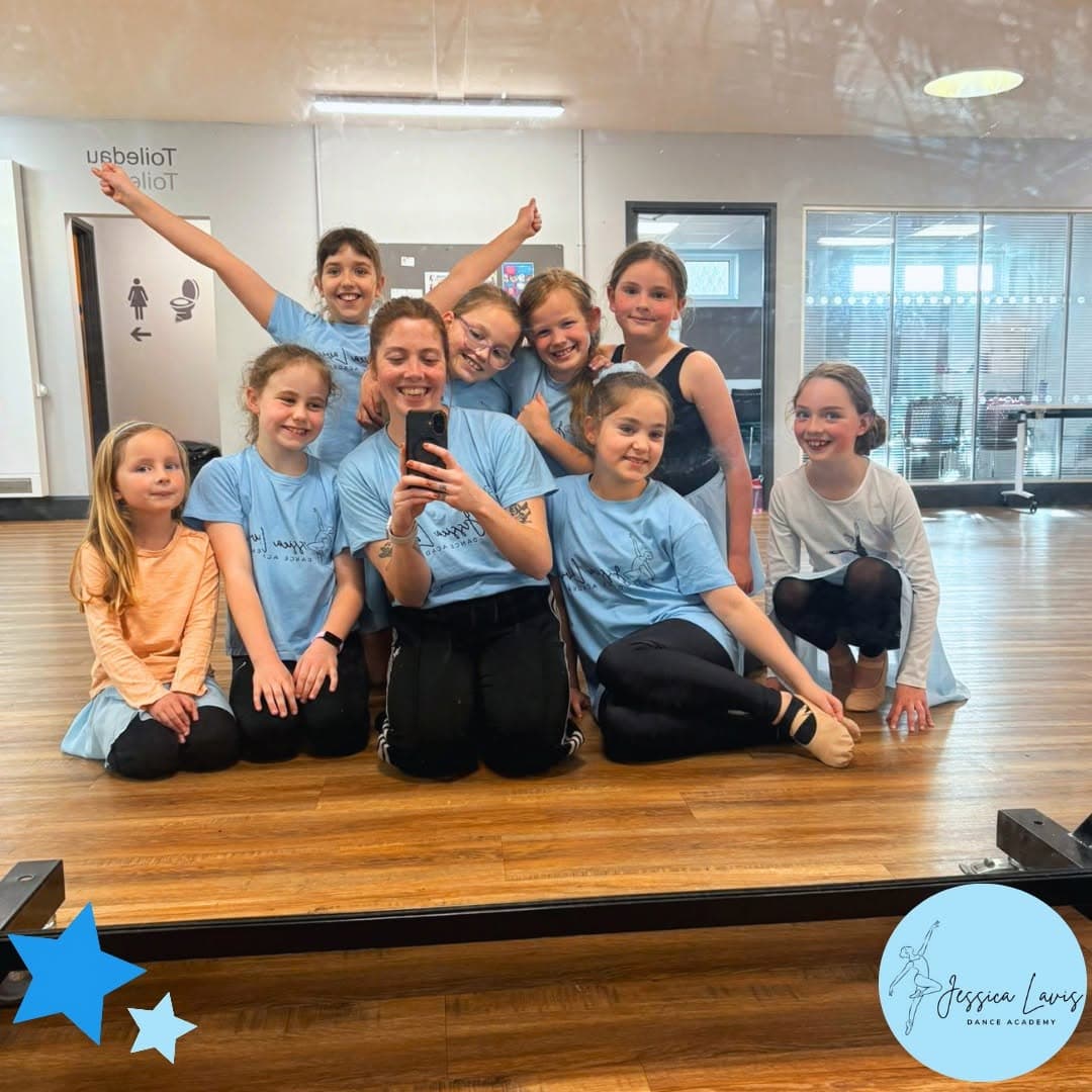 Miss Jess and her class posing for a mirror selfie in the studio